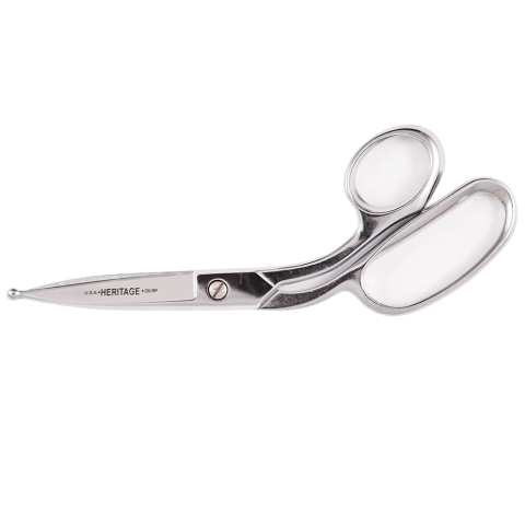 8-inch poultry shears with polished metal blades and large ergonomic finger rings for enhanced grip and control. One blade features a rounded ball point tip for safe, precise trimming. Engraved with 'U.S.A. HERITAGE 228LRP', this shear is designed for professional use in food prep and industrial cutting tasks.