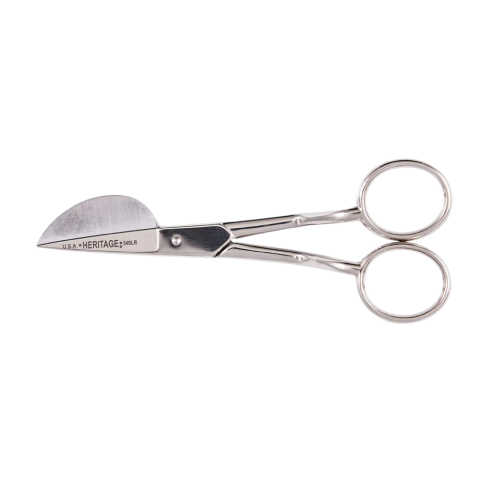 A pair of metal scissors with dual circular handles and asymmetrical blades—one curved, one straight—engraved with “U.S.A. HERITAGE 549LR.” Designed for controlled, close-up cutting.