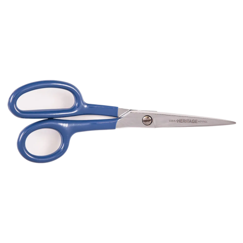 Professional-grade scissors with blue plastic handles and stainless steel blades, shown horizontally with blades pointing right. The blade is engraved with “HERITAGE 717CL U.S.A.” indicating the brand, model, and country of manufacture. Designed for right-handed use, the ergonomic handle features a smaller thumb loop and a larger finger loop for controlled, precise cutting—ideal for fabric, crafting, or detailed trimming tasks.